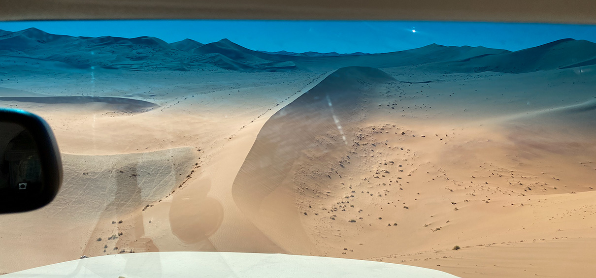 the view down the slipface of a very tall dune